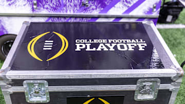 Jan 1, 2024; New Orleans, LA, USA; A general view of the College Football Playoff logo on a case on the Washington Huskies sideline before the 2024 Sugar Bowl college football playoff semifinal game between the Texas Longhorns and the Washington Huskies at Caesars Superdome. Mandatory Credit: Stephen Lew-USA TODAY Sports