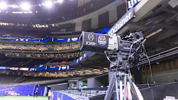 A general view of an ESPN television camera with the College Football Playoff logo before the 2024 Sugar Bowl college football playoff semifinal game between the Texas Longhorns and the Washington Huskies.