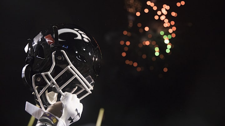 Cincinnati Bearcats player lifts his helmet after the Birmingham Bowl between Cincinnati Bearcats and Boston College Eagles on Thursday, Jan. 2, 2020, at Legion Field in Birmingham, Ala. Cincinnati Bearcats wont 38-6.

Birmingham Bowl