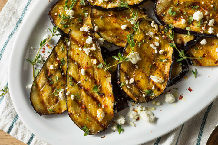 photo of grilled eggplant sprinkled with feta cheese