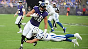 Aug 7, 2025; Baltimore, Maryland, USA; Baltimore Ravens tight end Charlie Kolar (88) is tackled by Indianapolis Colts safety Hunter Wohler (30) during the first quarter at M&T Bank Stadium.