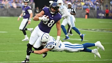 Aug 7, 2025; Baltimore, Maryland, USA; Baltimore Ravens tight end Charlie Kolar (88) is tackled by Indianapolis Colts safety Hunter Wohler (30) during the first quarter at M&T Bank Stadium. Mandatory Credit: Rafael Suanes-Imagn Images