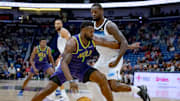 Jan 7, 2025; New Orleans, Louisiana, USA; New Orleans Pelicans forward Zion Williamson (1) dribbles around Minnesota Timberwolves forward Julius Randle (30) during the first half at Smoothie King Center. Mandatory Credit: Matthew Hinton-Imagn Images