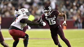Nov 16, 2024; College Station, Texas, USA; Texas A&M Aggies defensive lineman Rylan Kennedy (15) runs around the edge against the New Mexico State Aggies during the first half at Kyle Field. Mandatory Credit: Maria Lysaker-Imagn Images 