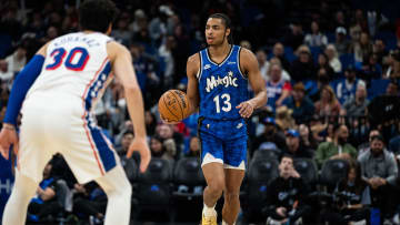 Jan 19, 2024; Orlando, Florida, USA; Orlando Magic guard Jett Howard (13) dribbles the ball against Philadelphia 76ers small guard Furkan Korkmaz (30) in the fourth quarter at KIA Center. Mandatory Credit: Jeremy Reper-USA TODAY Sports