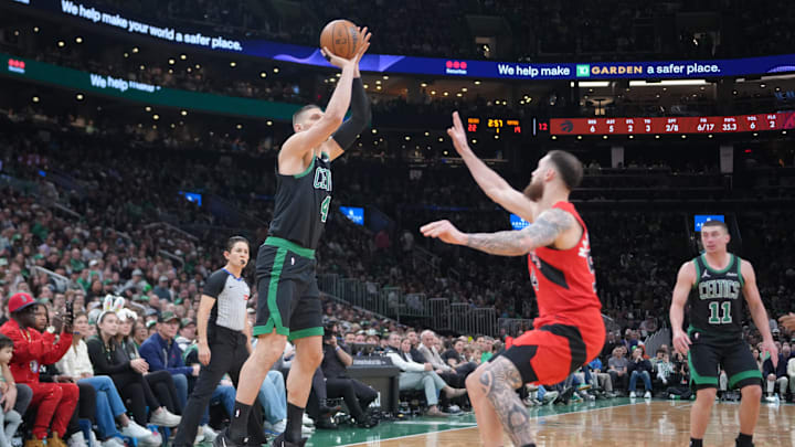 Apr 5, 2026; Boston, Massachusetts, USA;  Boston Celtics center Nikola Vucevic (4) shoots a jump shot against the Toronto Raptors during the first half at TD Garden. Mandatory Credit: Gregory Fisher-Imagn Images