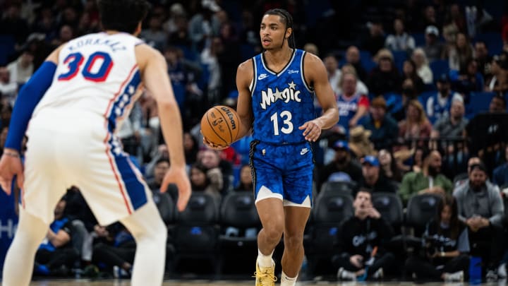 Orlando Magic guard Jett Howard (13) dribbles the ball against Philadelphia 76ers small guard Furkan Korkmaz (30) in the fourth quarter at KIA Center. 