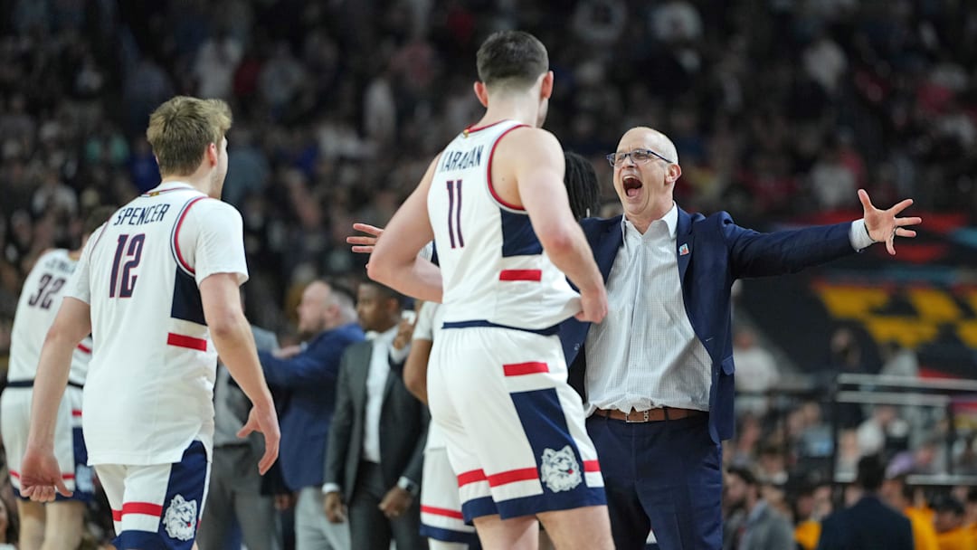 Apr 8, 2024; Glendale, AZ, USA; Connecticut Huskies head coach Dan Hurley celebrates with guard Cam Spencer (12) and forward Alex Karaban (11) during the second half of the national championship game of the Final Four of the 2024 NCAA Tournament at State Farm Stadium. Mandatory Credit: Bob Donnan-Imagn Images