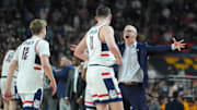 Apr 8, 2024; Glendale, AZ, USA; Connecticut Huskies head coach Dan Hurley celebrates with guard Cam Spencer (12) and forward Alex Karaban (11) during the second half of the national championship game of the Final Four of the 2024 NCAA Tournament at State Farm Stadium. Mandatory Credit: Bob Donnan-Imagn Images