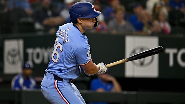 Apr 7, 2024; Arlington, Texas, USA; Texas Rangers pinch hitter Justin Foscue (56) gets his first career MLB hit and run batted in during the ninth inning against the Houston Astros at Globe Life Field. Apr 7, 2024; Arlington, Texas, USA; Texas Rangers pinch hitter Justin Foscue (56) gets his first career MLB hit and run batted in during the ninth inning against the Houston Astros at Globe Life Field.