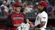 Jul 6, 2025; Phoenix, Arizona, USA; Arizona Diamondbacks manager Torey Lovullo (17) congratulates second base Ketel Marte (4) after making the All-star game in the first inning against the Kansas City Royals at Chase Field. Mandatory Credit: Rick Scuteri-Imagn Images