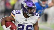 Dec 24, 2023; Minneapolis, Minnesota, USA; Minnesota Vikings running back Kene Nwangwu (26) returns a kickoff against the Detroit Lions during the game at U.S. Bank Stadium.