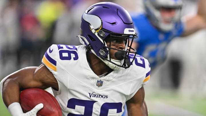 Dec 24, 2023; Minneapolis, Minnesota, USA; Minnesota Vikings running back Kene Nwangwu (26) returns a kickoff against the Detroit Lions during the game at U.S. Bank Stadium. Mandatory Credit: Jeffrey Becker-USA TODAY Sports