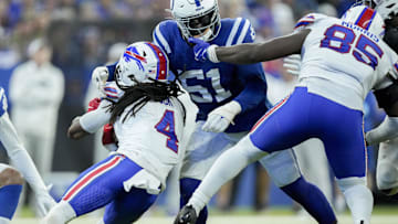 Nov 10, 2024; Indianapolis, Indiana, USA; Buffalo Bills tight end Quintin Morris (85) pulls on the face mask of Indianapolis Colts defensive end Kwity Paye (51) as he moves in to tackle Buffalo Bills running back James Cook (4) on Sunday, Nov. 10, 2024, during a game against the Buffalo Bills at Lucas Oil Stadium in Indianapolis. Mandatory Credit: Grace Hollars-USA TODAY Network via Imagn Images