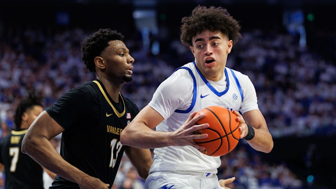 Feb 28, 2026; Lexington, Kentucky, USA; Kentucky Wildcats center Malachi Moreno (24) spins to the basket around Vanderbilt Commodores forward Jalen Washington (13) during the second half at Rupp Arena at Central Bank Center. Mandatory Credit: Jordan Prather-Imagn Images