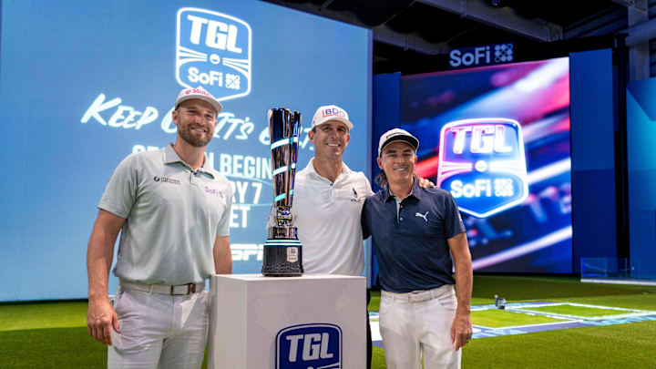 Golfers Wyndham Clark, left, Billy Horschel, center, and Rickie Fowler pose for a photo next to the TGL trophy during media day at the SoFi Center, the home of TGL, the interactive golf league founded by Tiger Woods and Rory McIlroy on December 18, 2024, in Palm Beach Gardens, Florida. Golfers Wyndham Clark, left, Billy Horschel, center, and Rickie Fowler pose for a photo next to the TGL trophy during media day at the SoFi Center, the home of TGL, the interactive golf league founded by Tiger Woods and Rory McIlroy on December 18, 2024, in Palm Beach Gardens, Florida.