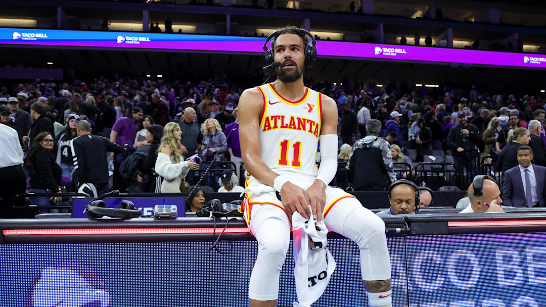 Nov 18, 2024; Sacramento, California, USA; Atlanta Hawks guard Trae Young (11) is interviewed by media after the game against the Sacramento Kings at Golden 1 Center. Mandatory Credit: Sergio Estrada-Imagn Images