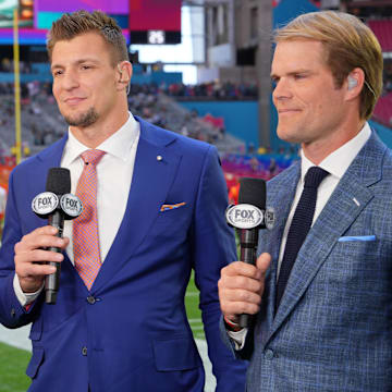 Feb 12, 2023; Glendale, Arizona, US; (Left to right) FOX Sports personalities Howie Long, Rob Gronkowski, and Greg Olsen before Super Bowl LVII at State Farm Stadium.