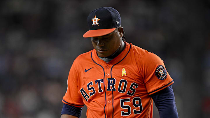 Sep 7, 2025; Arlington, Texas, USA; Houston Astros starting pitcher Framber Valdez (59) looks down as he walks off the field during the game between the Texas Rangers and the Houston Astros at Globe Life Field. Mandatory Credit: Jerome Miron-Imagn Images