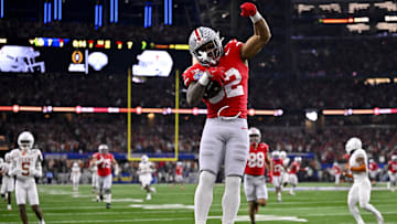 Jan 10, 2025; Arlington, TX, USA;  Ohio State Buckeyes running back TreVeyon Henderson (32) scores a touchdown on a pass from quarterback Will Howard (not pictured) during the second quarter at AT&T Stadium. Mandatory Credit: Jerome Miron-Imagn Images