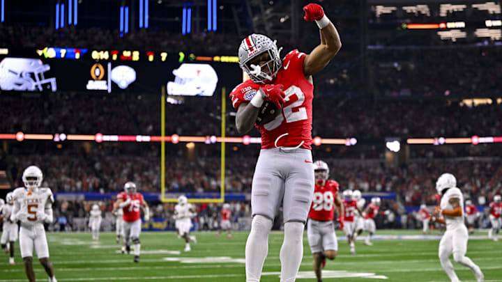 Jan 10, 2025; Arlington, TX, USA;  Ohio State Buckeyes running back TreVeyon Henderson (32) scores a touchdown on a pass from quarterback Will Howard (not pictured) during the second quarter at AT&T Stadium. Mandatory Credit: Jerome Miron-Imagn Images