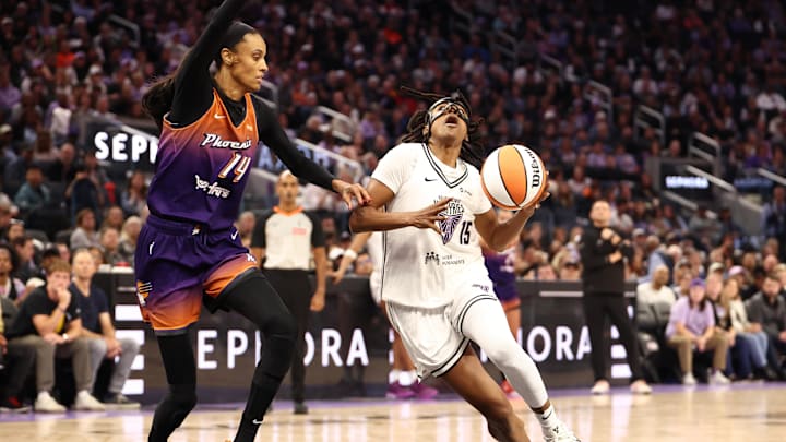 Jul 14, 2025; San Francisco, California, USA; Golden State Valkyries guard Tiffany Hayes (15) drives in against Phoenix Mercury guard DeWanna Bonner (14) during the second quarter at Chase Center. Mandatory Credit: Kelley L Cox-Imagn Images