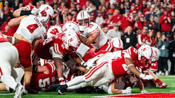 Nov 23, 2024; Lincoln, Nebraska, USA; Nebraska Cornhuskers running back Dante Dowdell (23) scores a touchdown against the Wisconsin Badgers during the fourth quarter at Memorial Stadium.