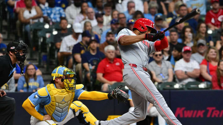 Jun 14, 2024; Milwaukee, Wisconsin, USA; Cincinnati Reds third baseman Jeimer Candelario (3) hits a two-run home run as Milwaukee Brewers catcher William Contreras (24) looks on in the fifth inning at American Family Field. Mandatory Credit: Benny Sieu-USA TODAY Sports