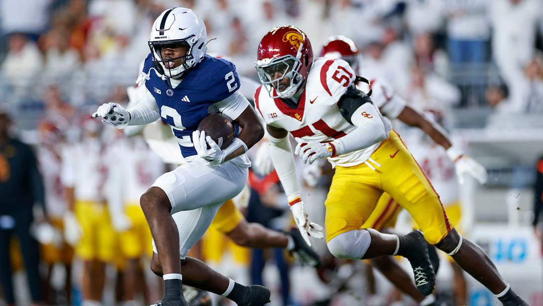 Zay Robinson running away from a USC defender in his first White Out