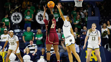 Notre Dame guard Cassandre Prosper (8) attempts to block a shot by Florida State guard Ta'Niya Latson (00) during a NCAA women's basketball game between No. 3 Notre Dame and No. 24 Florida State at Purcell Pavilion on Thursday, Feb. 27, 2025, in South Bend.