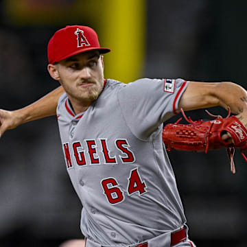 Sep 5, 2024; Arlington, Texas, USA; Los Angeles Angels starting pitcher Jack Kochanowicz (64) pitches against the Texas Rangers during the first inning at Globe Life Field.