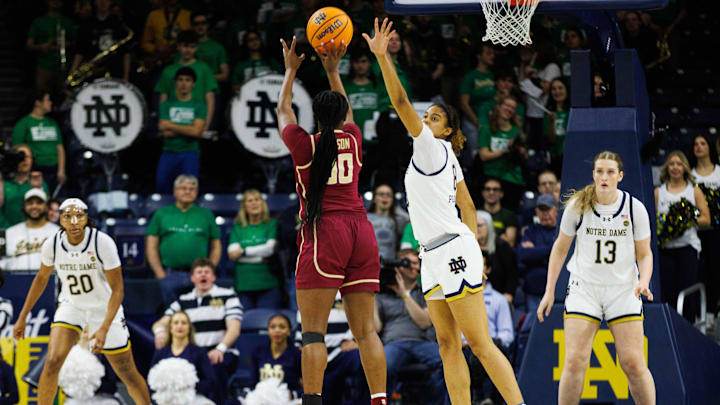 Notre Dame guard Cassandre Prosper (8) attempts to block a shot by Florida State guard Ta'Niya Latson (00) during a NCAA women's basketball game between No. 3 Notre Dame and No. 24 Florida State at Purcell Pavilion on Thursday, Feb. 27, 2025, in South Bend.