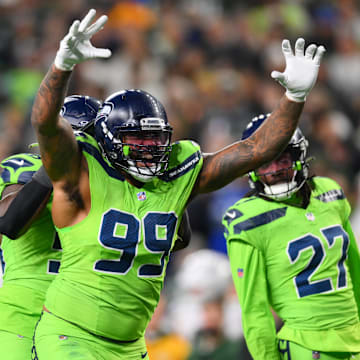 Dec 15, 2024; Seattle, Washington, USA; Seattle Seahawks defensive end Leonard Williams (99) celebrates after a defensive play against the Green Bay Packers during the second half at Lumen Field. Mandatory Credit: Steven Bisig-Imagn Images