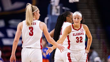 Mar 6, 2025; Greenville, SC, USA; Alabama Crimson Tide guard Aaliyah Nye (32) celebrates with guard Sarah Ashlee Barker (3) during the first half against the Florida Gators at Bon Secours Wellness Arena. Mandatory Credit: Scott Kinser-Imagn Images