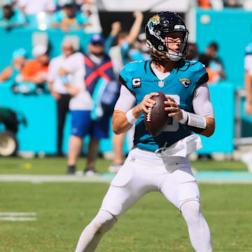 Sep 8, 2024; Miami Gardens, Florida, USA; Jacksonville Jaguars quarterback Trevor Lawrence (16) looks for a passing option against the Miami Dolphins during the fourth quarter at Hard Rock Stadium. Mandatory Credit: Sam Navarro-Imagn Images