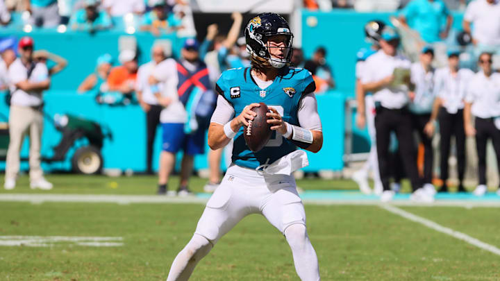 Sep 8, 2024; Miami Gardens, Florida, USA; Jacksonville Jaguars quarterback Trevor Lawrence (16) looks for a passing option against the Miami Dolphins during the fourth quarter at Hard Rock Stadium. Mandatory Credit: Sam Navarro-Imagn Images