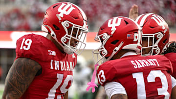 Oct 18, 2025; Bloomington, Indiana, USA; Indiana Hoosiers tight end Holden Staes (19) and wide receiver Elijah Sarratt (13) celebrate after a touchdown during the second half against the Michigan State Spartans at Memorial Stadium. Mandatory Credit: Robert Goddin-Imagn Images