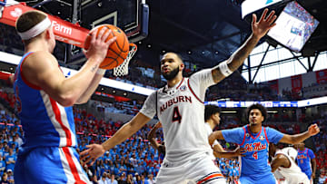 Feb 1, 2025; Oxford, Mississippi, USA; Auburn Tigers forward/center Johni Broome (4) defends as Mississippi Rebels guard Sean Pedulla (3) in bounds the ball during the second half at The Sandy and John Black Pavilion at Ole Miss. Mandatory Credit: Petre Thomas-Imagn Images