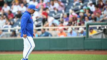 Jun 19, 2024; Omaha, NE, USA;  Florida Gators head coach Kevin O'Sullivan walks off the mound during the game against the Texas A&M Aggies during the first inning at Charles Schwab Field Omaha. Mandatory Credit: Steven Branscombe-Imagn Images