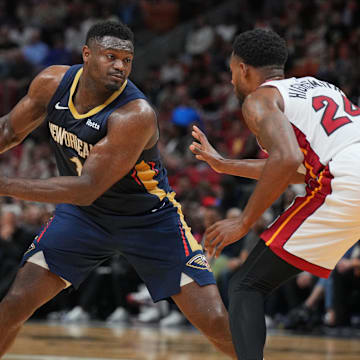 Mar 22, 2024; Miami, Florida, USA;  New Orleans Pelicans forward Zion Williamson (1) brings the ball up the court as Miami Heat forward Haywood Highsmith (24) during the first half at Kaseya Center. Mandatory Credit: Jim Rassol-Imagn Images