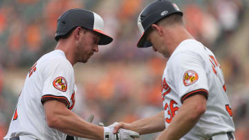 Jul 9, 2024; Baltimore, Maryland, USA; Baltimore Orioles second baseman Jordan Westburg (2) greeted by coach Tony Mansolino (36) following his solo home run in the second inning against the Chicago Cubs at Oriole Park at Camden Yards. Mandatory Credit: Mitch Stringer-USA TODAY Sports