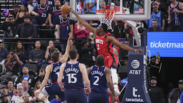 Apr 9, 2025; Inglewood, California, USA; Houston Rockets center N'Faly Dante (3) block Los Angeles Clippers guard Bogdan Bogdanovic (10) in the second half at Intuit Dome. Mandatory Credit: Kirby Lee-Imagn Images