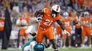 Aug 30, 2025; Charlottesville, Virginia, USA; Virginia Cavaliers running back Harrison Waylee (21) carries the ball as Coastal Carolina Chanticleers cornerback Myles Mooyoung (8) defends during the second half at Scott Stadium. Mandatory Credit: Amber Searls-Imagn Images