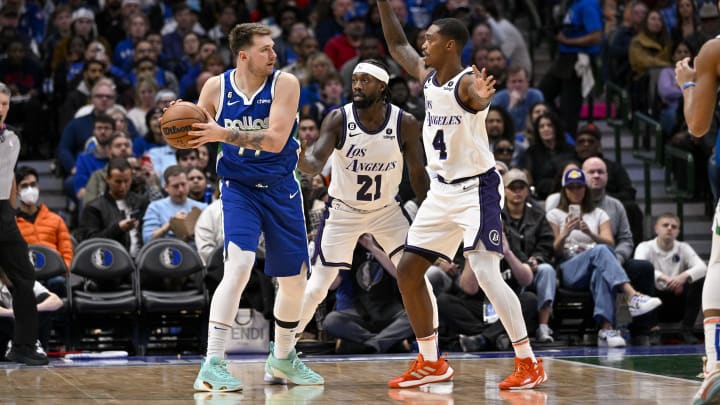 Dec 25, 2022; Dallas, Texas, USA; Dallas Mavericks guard Luka Doncic (77) and Los Angeles Lakers guard Patrick Beverley (21) and guard Lonnie Walker IV (4) in action during the game between the Dallas Mavericks and the Los Angeles Lakers at American Airlines Center. Mandatory Credit: Jerome Miron-USA TODAY Sports