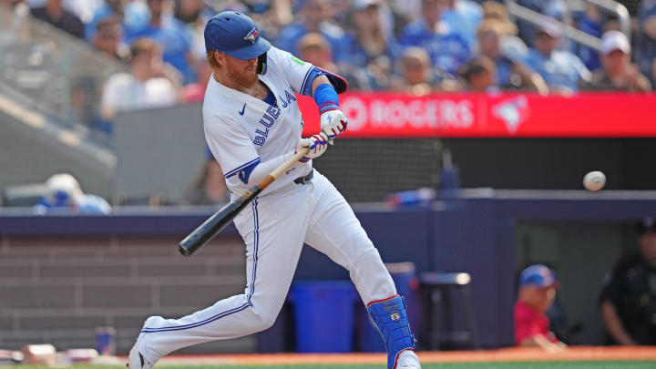 Toronto Blue Jays designated hitter Justin Turner hits a double against the Texas Rangers on Saturday at Rogers Centre.