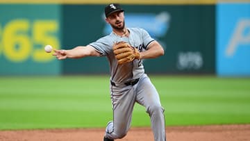 Jul 2, 2024; Cleveland, Ohio, USA; Chicago White Sox shortstop Paul DeJong (29) attempts to throw out Cleveland Guardians first baseman Josh Naylor (not pictured) at third base during the sixth inning at Progressive Field. DeJong hit Naylor with the ball and Naylor scored on the play. Mandatory Credit: Ken Blaze-USA TODAY Sports