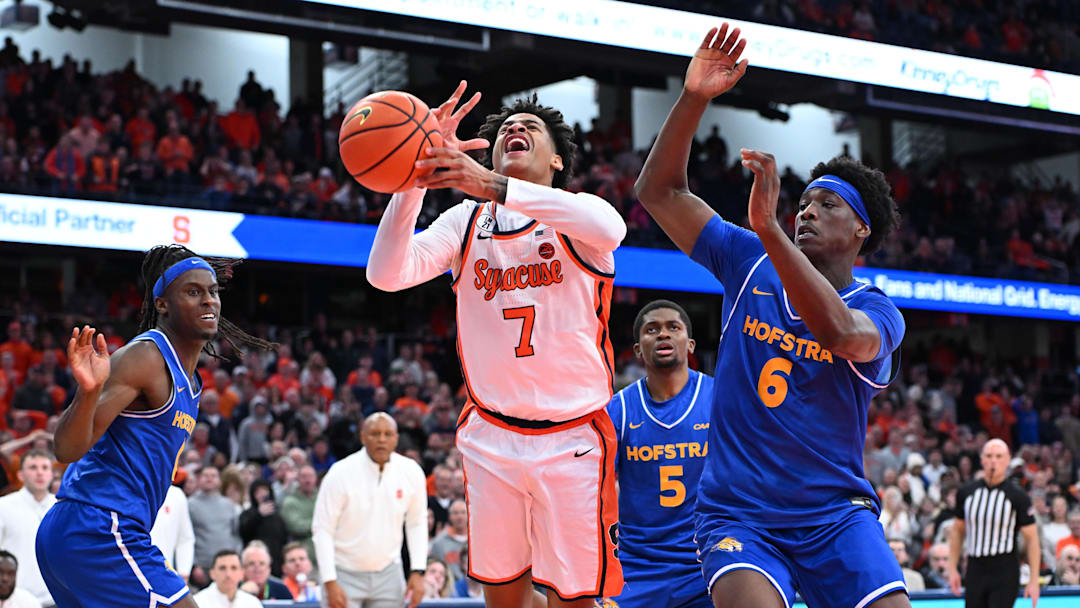 Dec 13, 2025; Syracuse, New York, USA; Syracuse Orange forward Kiyan Anthony (7) collides with Hofstra Pride forward Victory Onuetu (6) on a shot in the second half at the JMA Wireless Dome. Mandatory Credit: Mark Konezny-Imagn Images Dec 13, 2025; Syracuse, New York, USA; Syracuse Orange forward Kiyan Anthony (7) collides with Hofstra Pride forward Victory Onuetu (6) on a shot in the second half at the JMA Wireless Dome. Mandatory Credit: Mark Konezny-Imagn Images