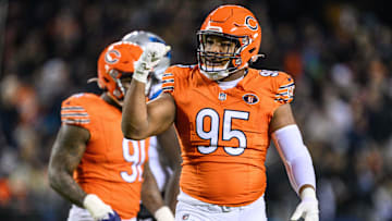 Nov 9, 2023; Chicago, Illinois, USA; Chicago Bears defensive lineman DeMarcus Walker (95) celebrates a defensive play against the Carolina Panthers during the second quarter at Soldier Field.