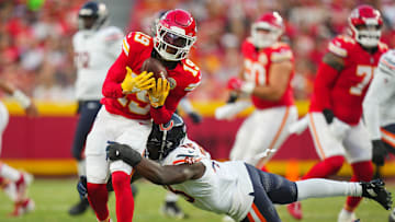 Aug 22, 2024; Kansas City, Missouri, USA; Kansas City Chiefs wide receiver Kadarius Toney (19) is tackled by Chicago Bears linebacker Amen Ogbongbemiga (45) during the first half at GEHA Field at Arrowhead Stadium. Mandatory Credit: Jay Biggerstaff-Imagn Images