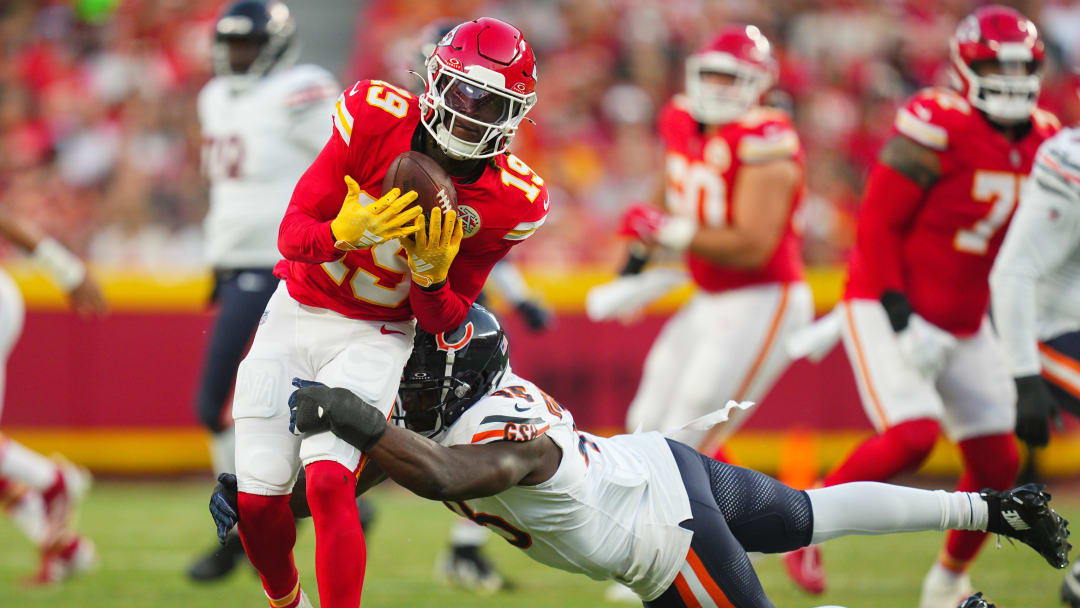 Aug 22, 2024; Kansas City, Missouri, USA; Kansas City Chiefs wide receiver Kadarius Toney (19) is tackled by Chicago Bears linebacker Amen Ogbongbemiga (45) during the first half at GEHA Field at Arrowhead Stadium. Mandatory Credit: Jay Biggerstaff-USA TODAY Sports